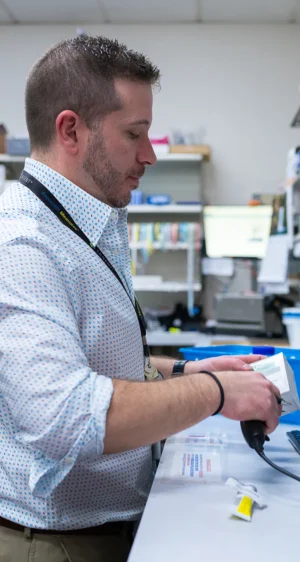 Pharmacist scanning medication